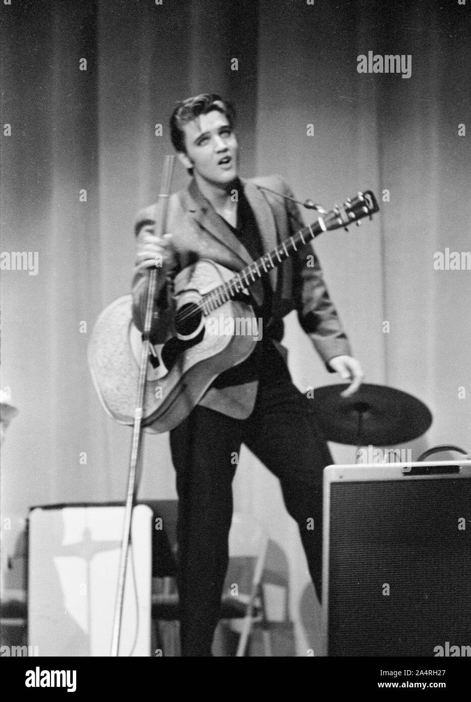Elvis Presley performing on May 26, 1956. The performance took place at the Veteran’s Memorial Auditorium, Columbus, Ohio. Stock Photo