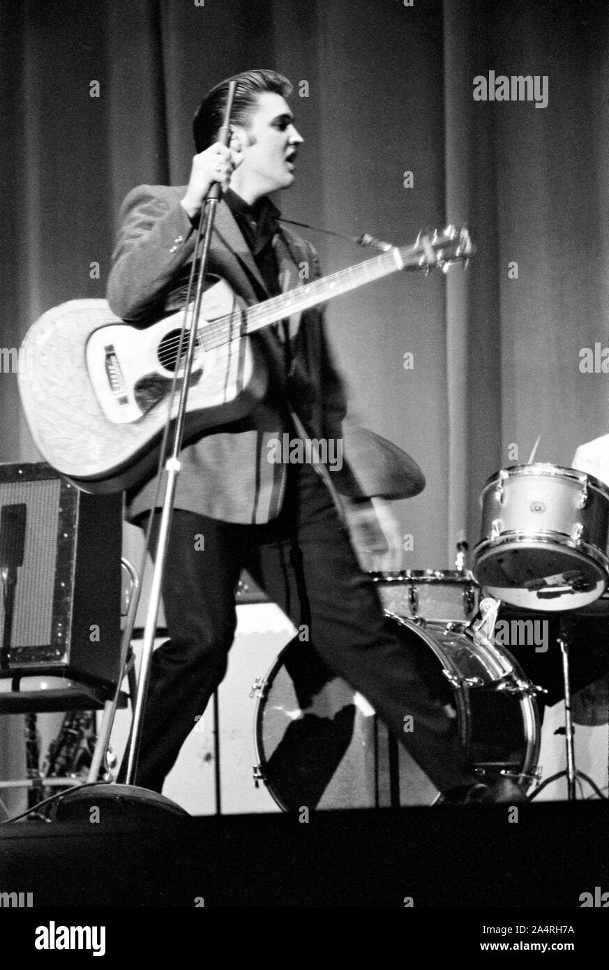 Elvis Presley performing on May 26, 1956. The performance took place at the Veteran’s Memorial Auditorium, Columbus, Ohio. Stock Photo