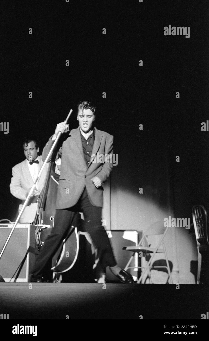 Elvis Presley performing on May 26, 1956. The performance took place at the Veteran’s Memorial Auditorium, Columbus, Ohio. Stock Photo