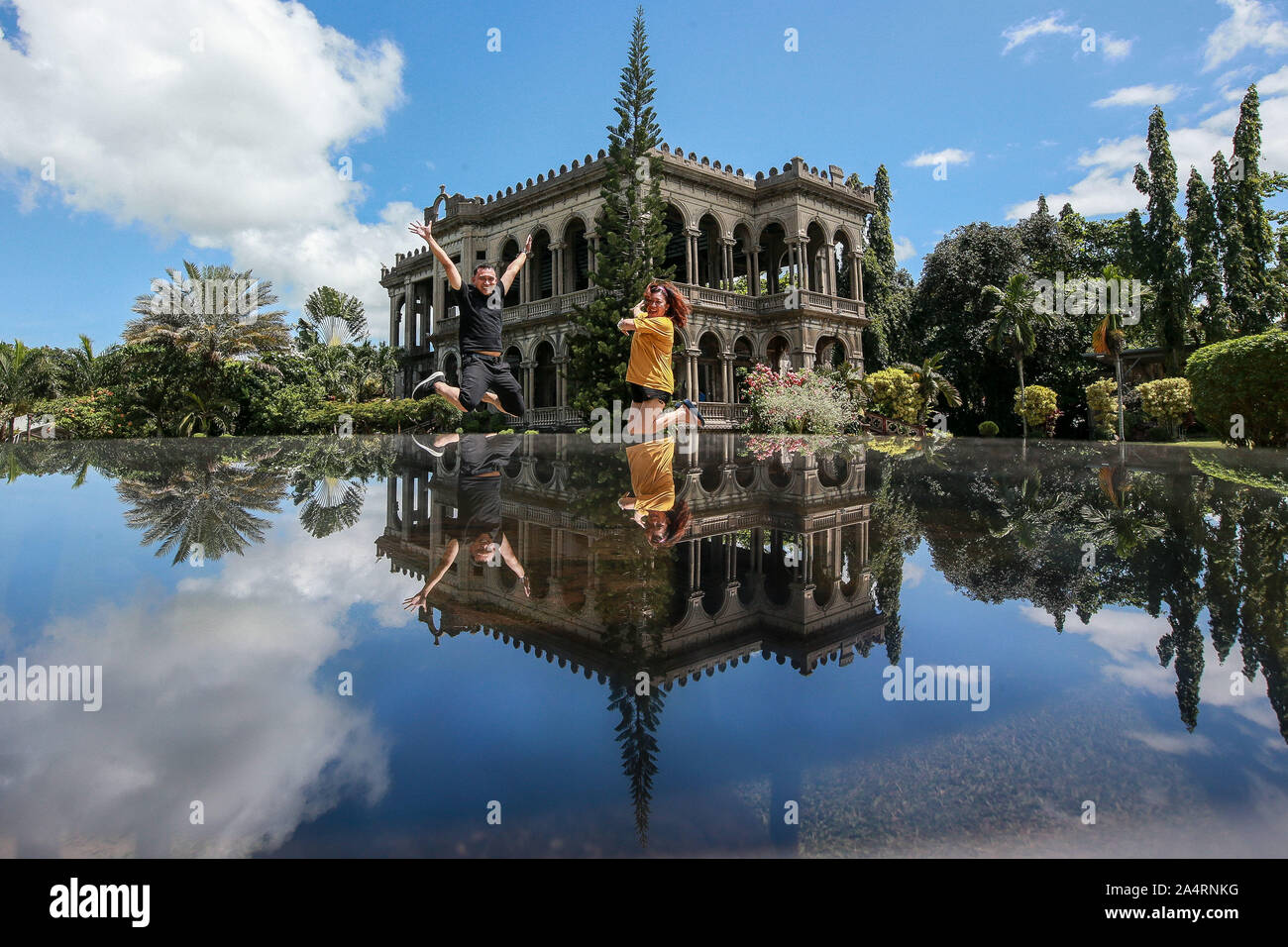 Talisay City, Philippines. 16th Oct, 2019. People pose for photo as they visit a tourist spot called The Ruins in Talisay City, the Philippines, Oct. 16, 2019. Credit: Rouelle Umali/Xinhua/Alamy Live News Stock Photo