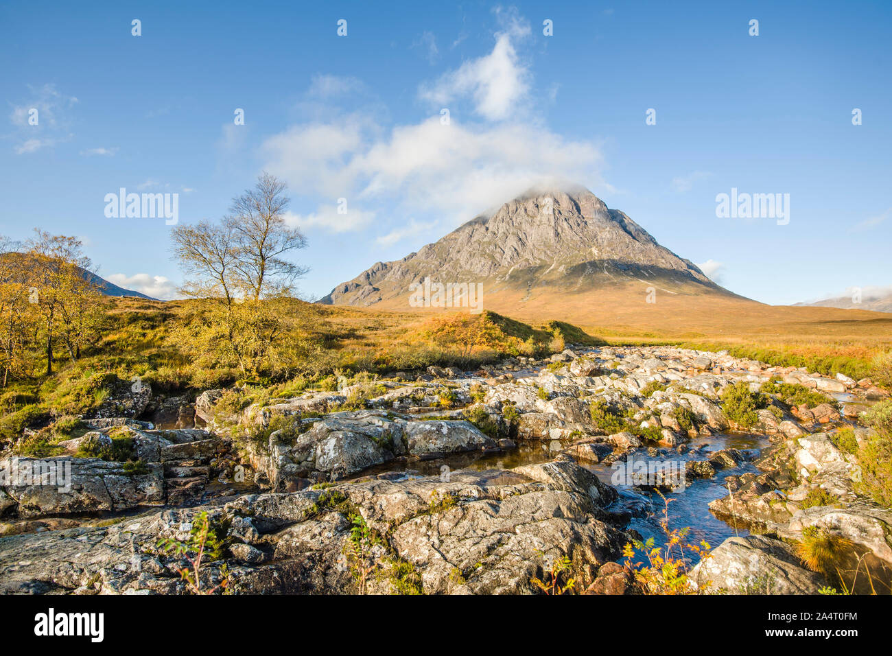 Buachaille Etive Mor in Glen Etive looks Autumnal this morning as Scotland wakes up to bright sunshine throughout the day.  Credit: Euan Cherry Stock Photo