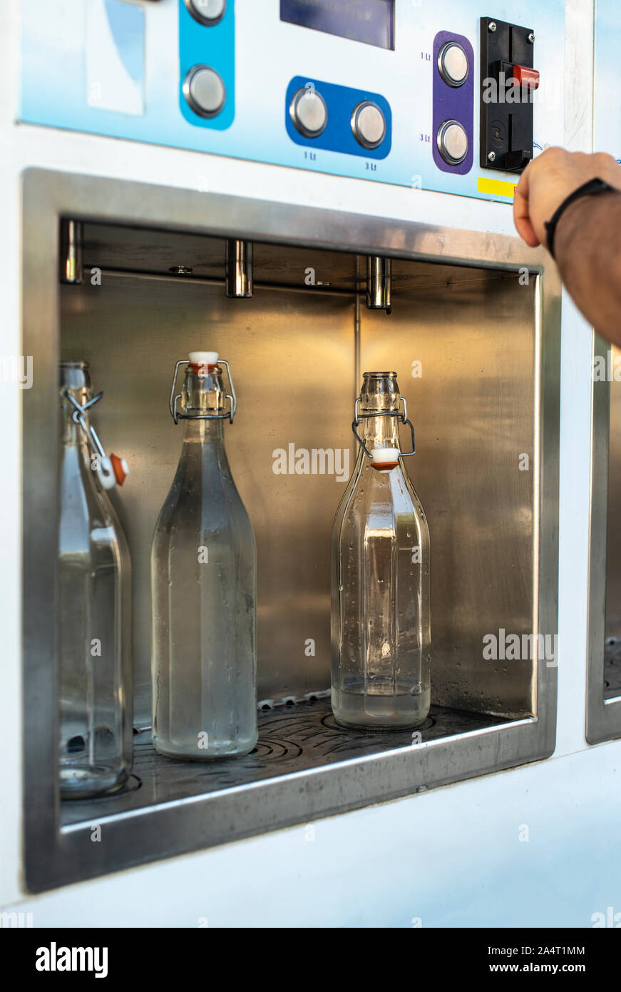 Mineral Water machine on the street. Filling mineral water bottles from