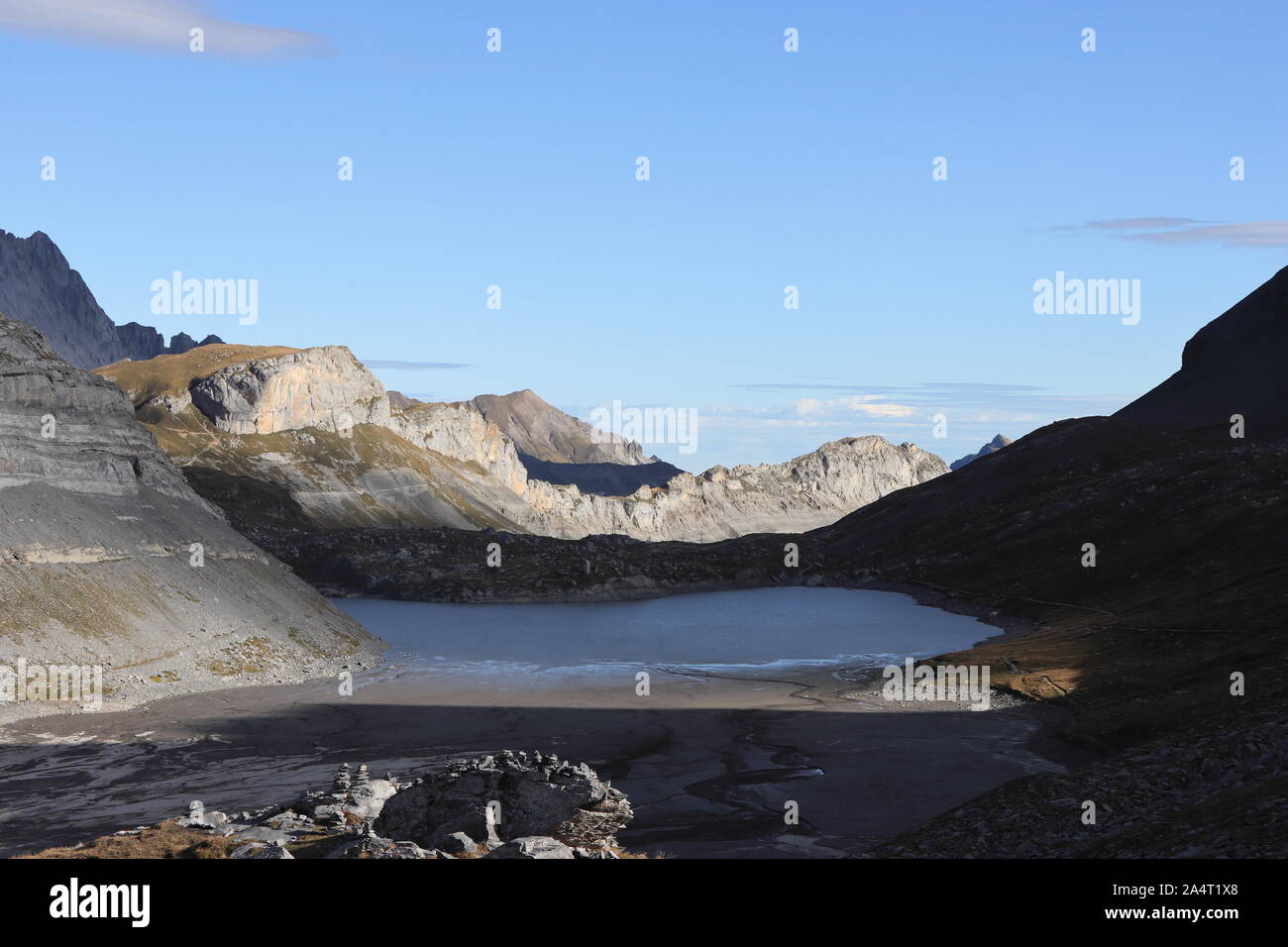 Daubensee is a Swiss mountain lake on the north side of the Gemmi mountain pass at Leukerbad. The altitude is 2200 meters over sea. Stock Photo