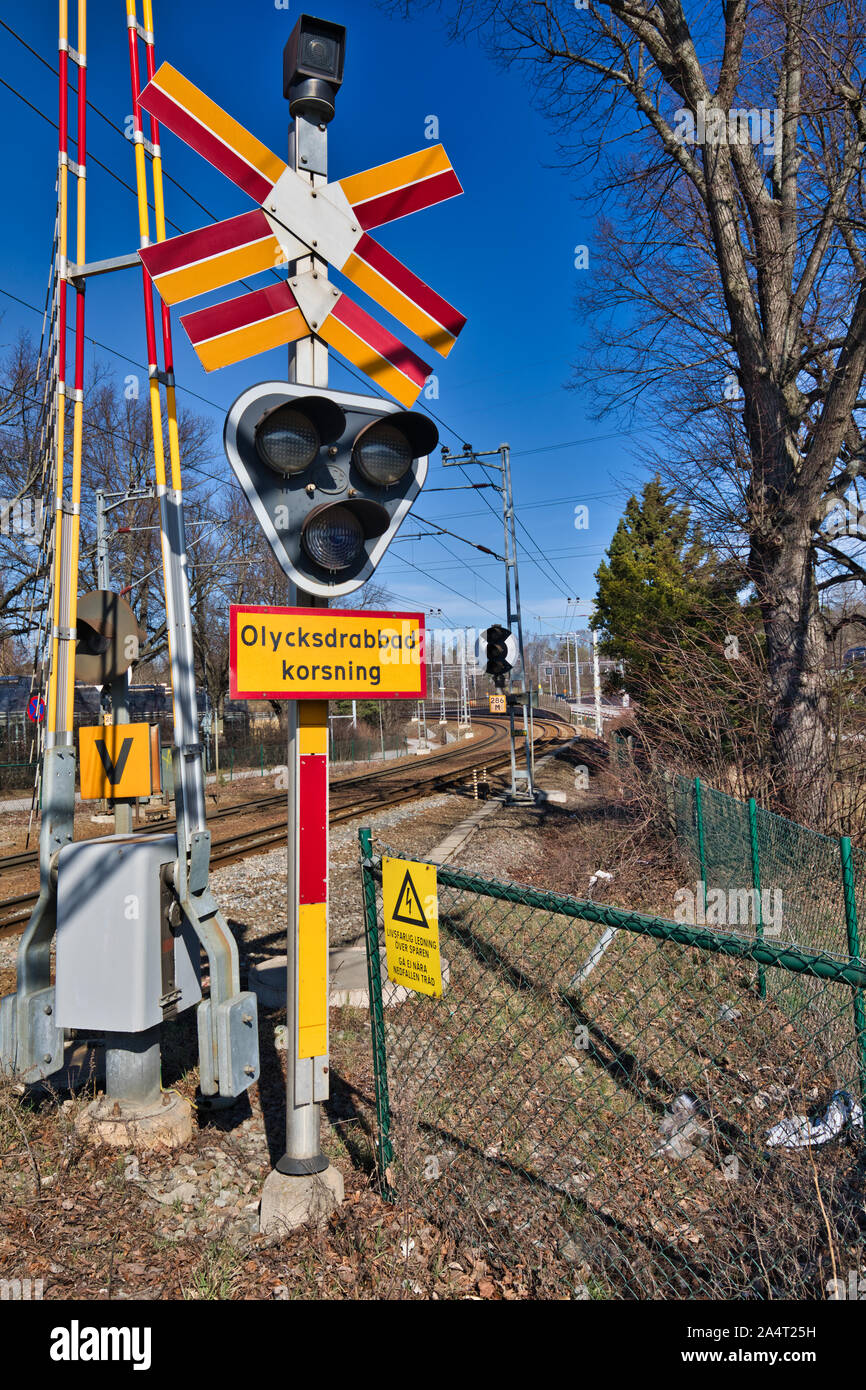 Warning Sign In Swedish And Colourful Warning Barriers At Level Crossing In Stockholm Sweden Stock Photo Alamy Warning Sign In Swedish And Colourful Warning Barriers At Level Crossing In Stockholm Sweden Stock Photo Alamy