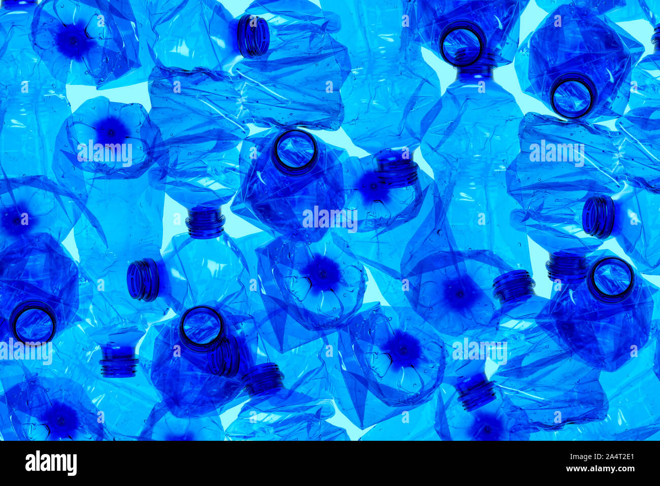 Used plastic bottles background. Recyclable waste concept. Stock Photo