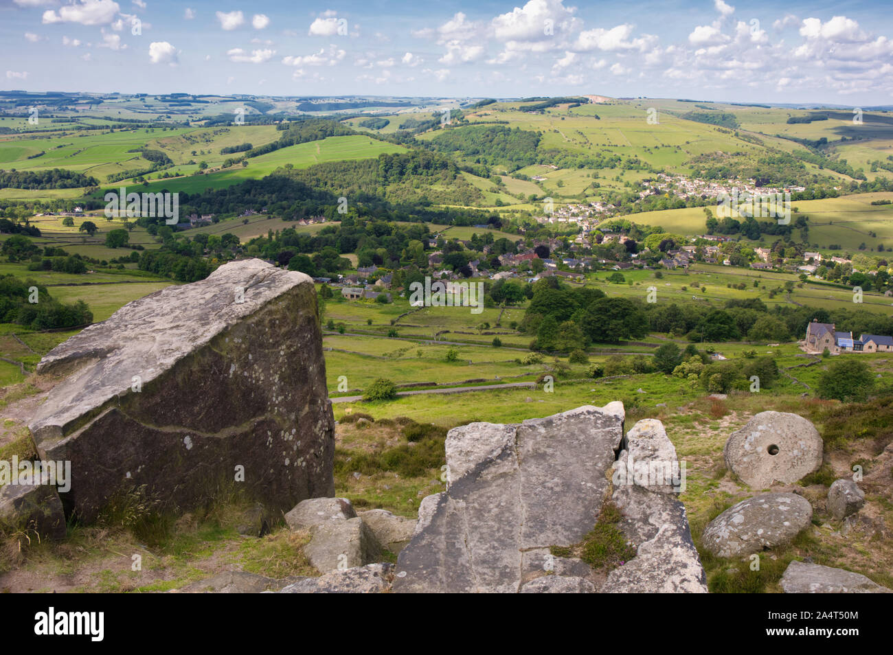 Panoramic view from Curbar Edge escarpment and abandoned millstone, Peak  District National Park, Derbyshire, England Stock Photo