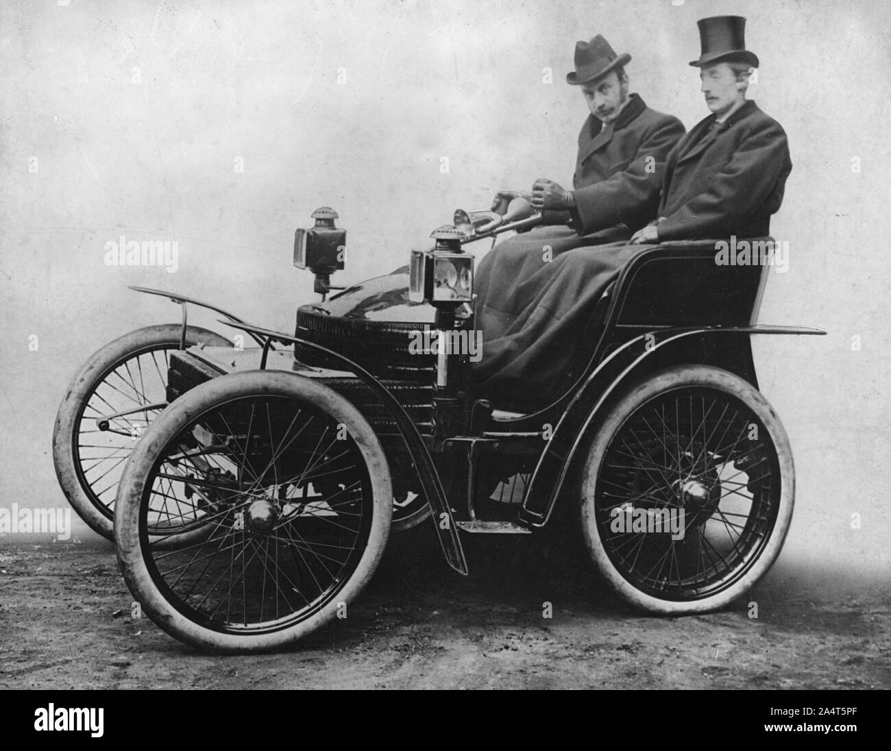 Herbert Austin at tiller of first 4 wheel Wolseley 1899. Stock Photo