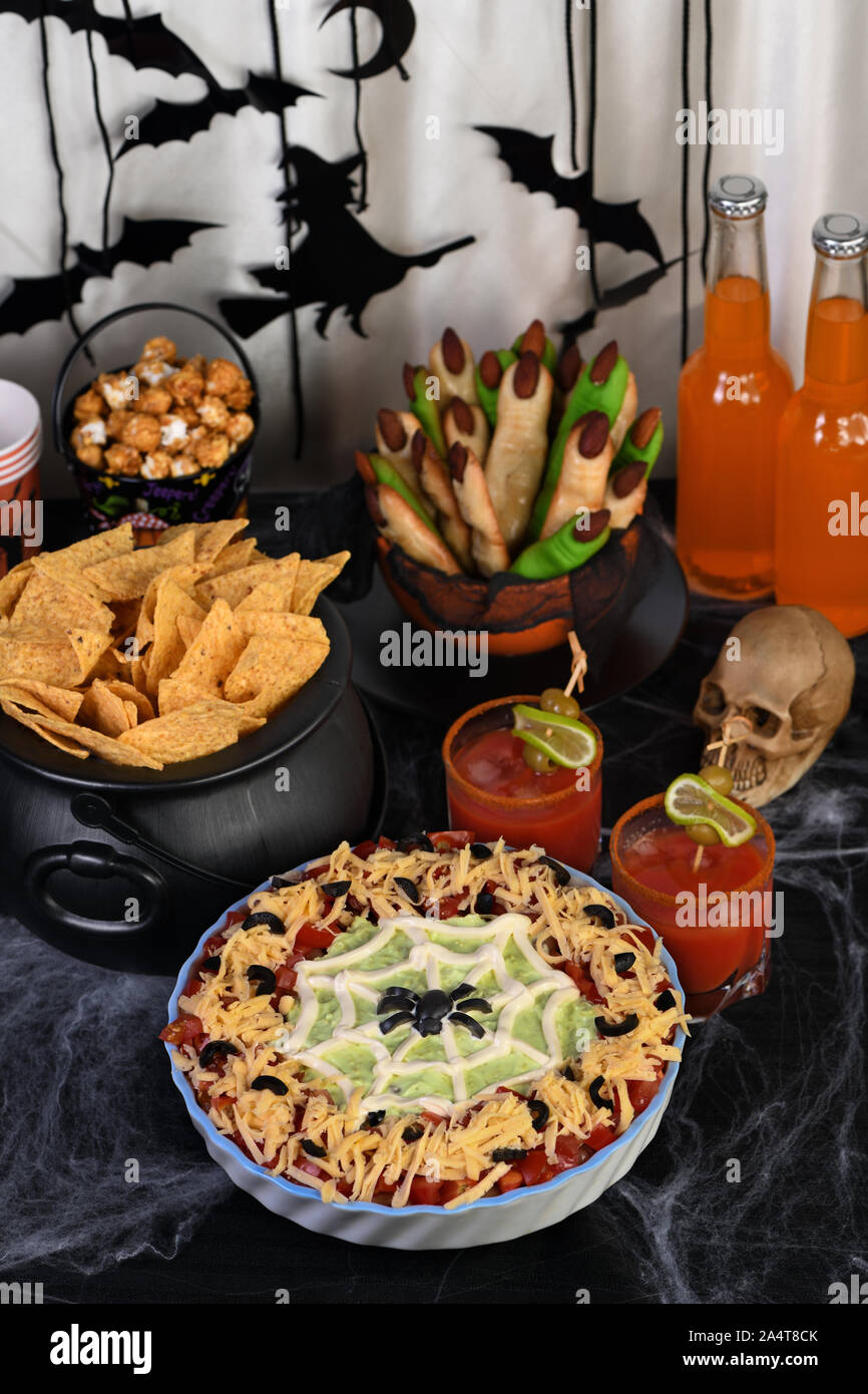 Spooky Halloween Seven Layer Taco Dip Turn a classic appetizer into a