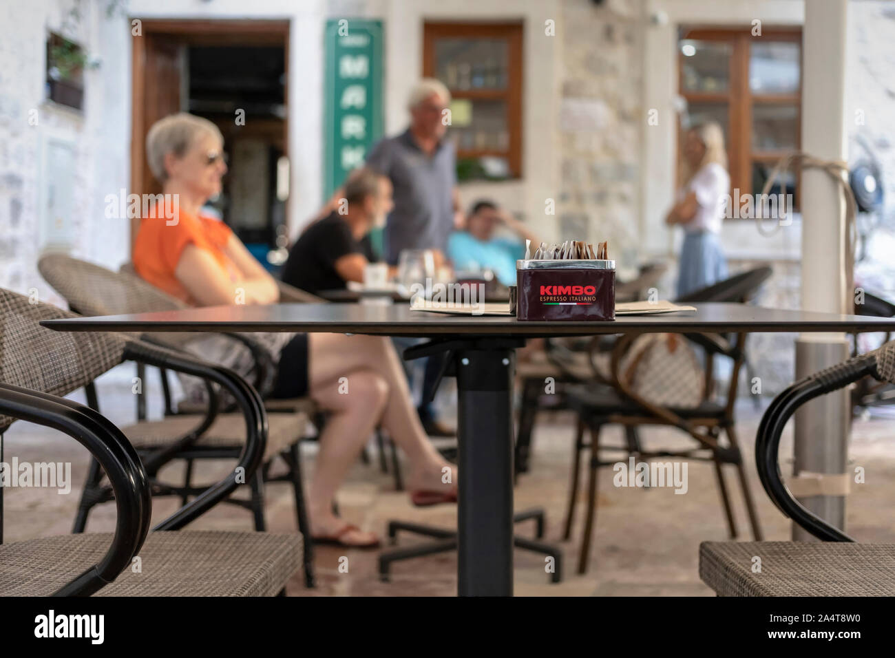 Montenegro, Sep 16, 2019: Street scene with guests sitting at an outdoor cafe in the Old Town of Kotor Stock Photo