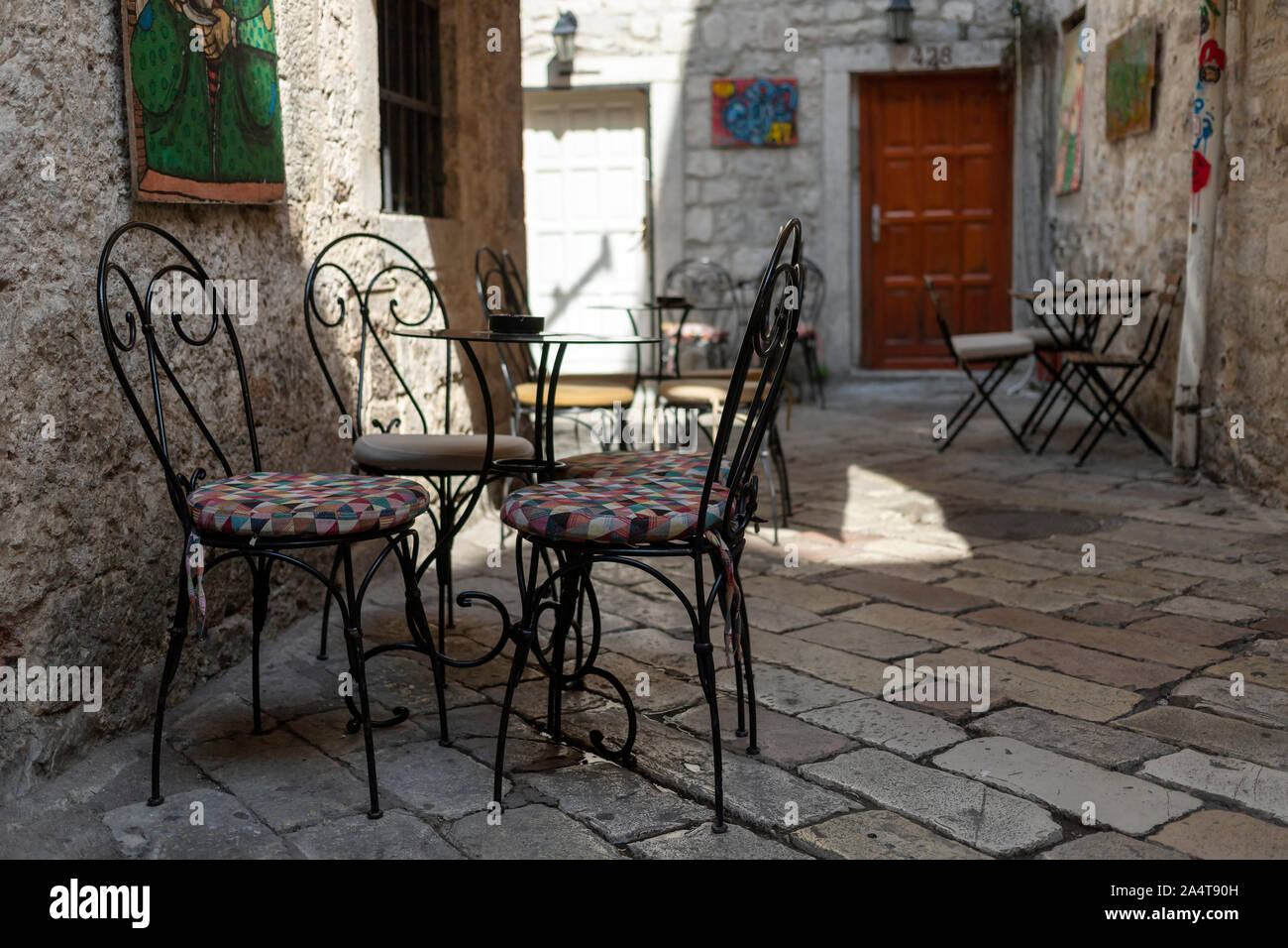 Montenegro - An empty street café in Old Town of Kotor Stock Photo