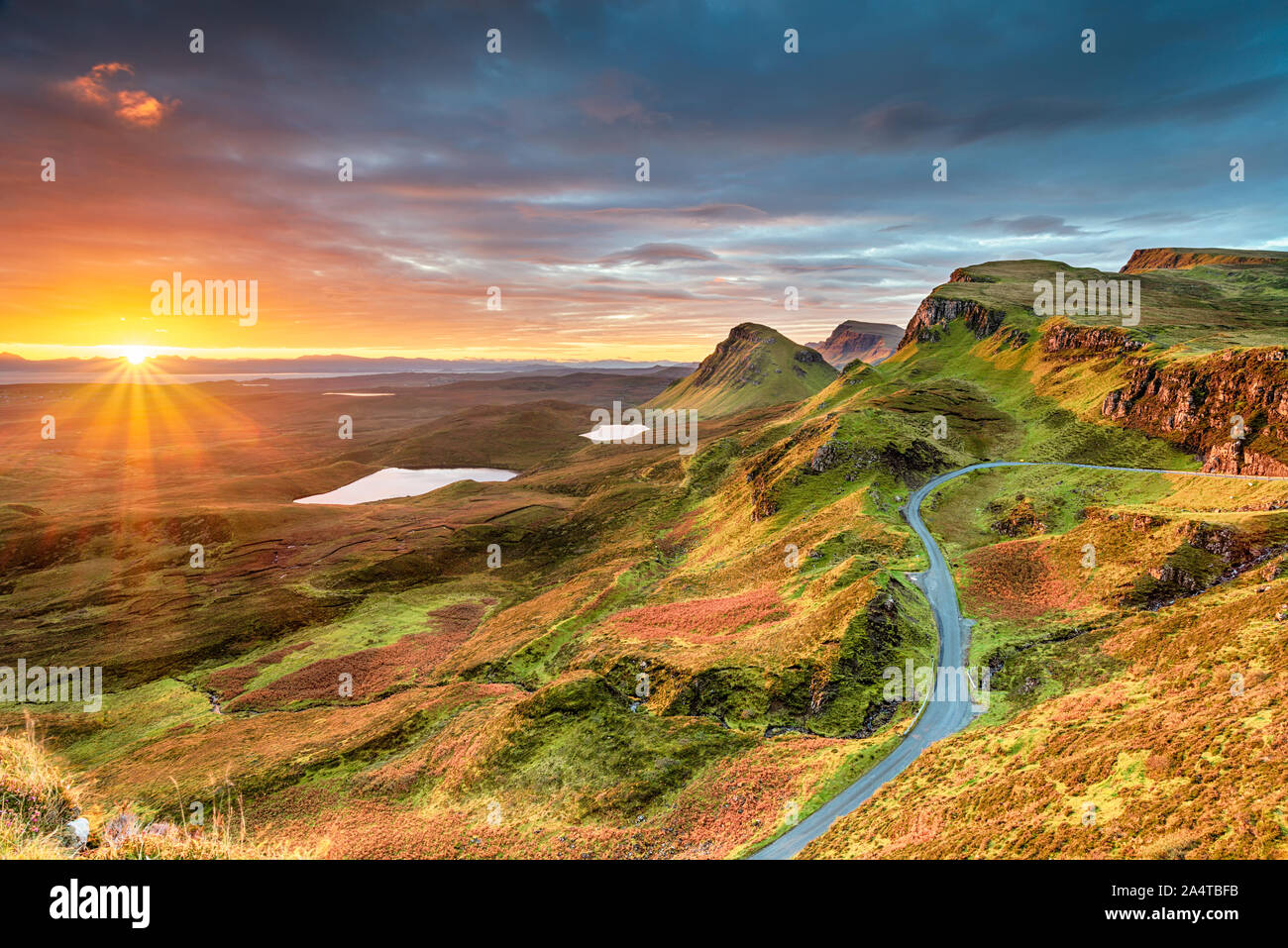 Beautiful Autumn sunrise over the Quiraing and it's steep winding mountain road, on the Isle of Skye in Scotland Stock Photo