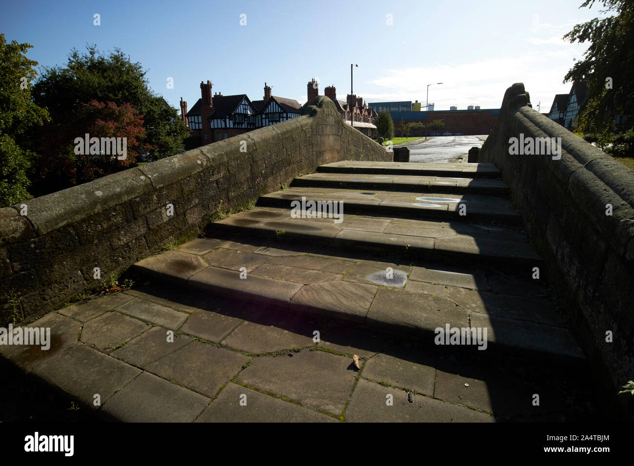 walking over dell bridge Port Sunlight England UK Stock Photo