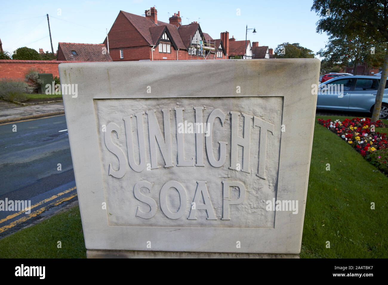 sunlight soap carved stone logo outside Lever house Port Sunlight England UK Stock Photo