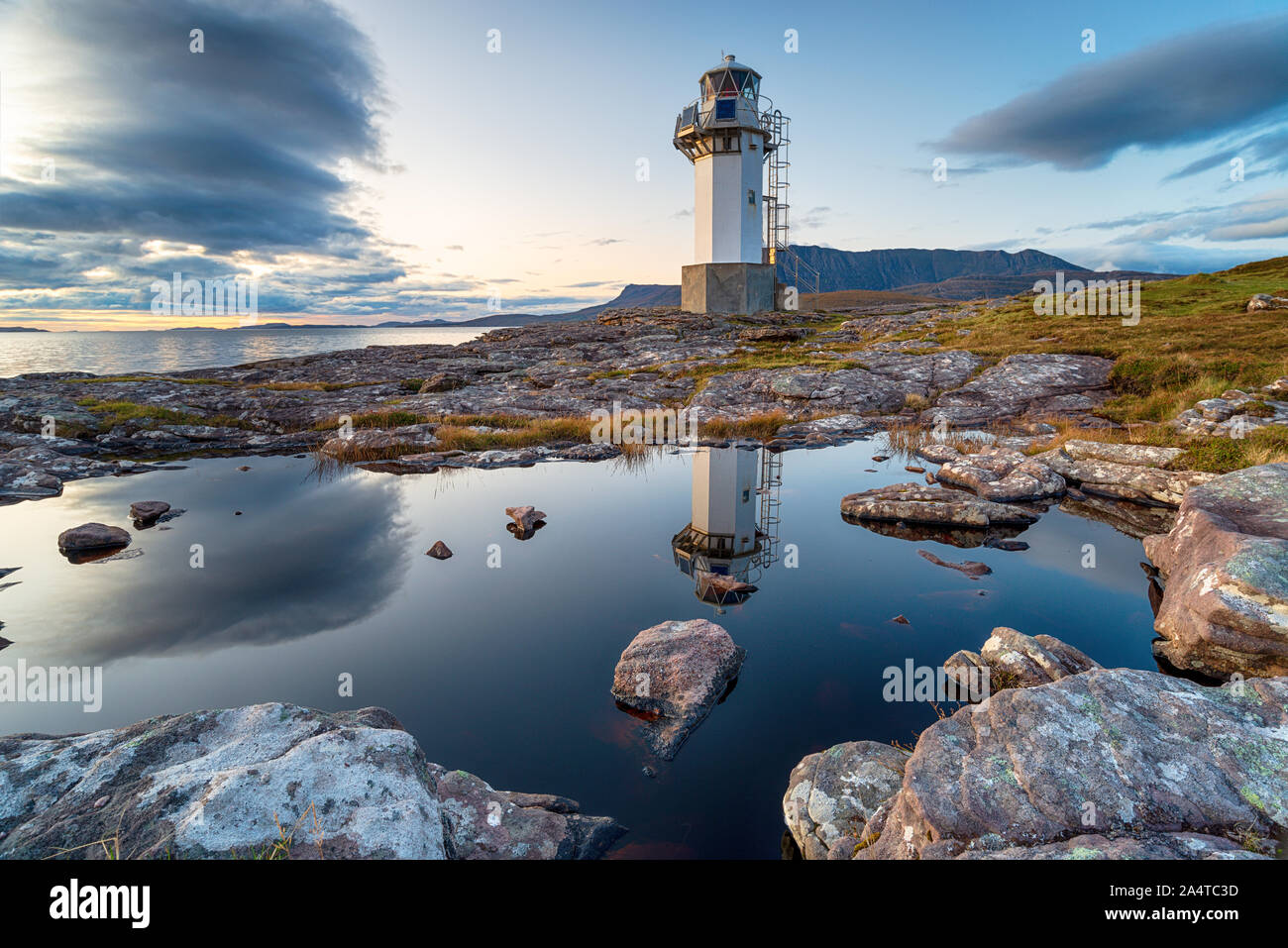 Dusk at Rhue lighthouse near Ullapool in the Highlands of Scotland Stock Photo