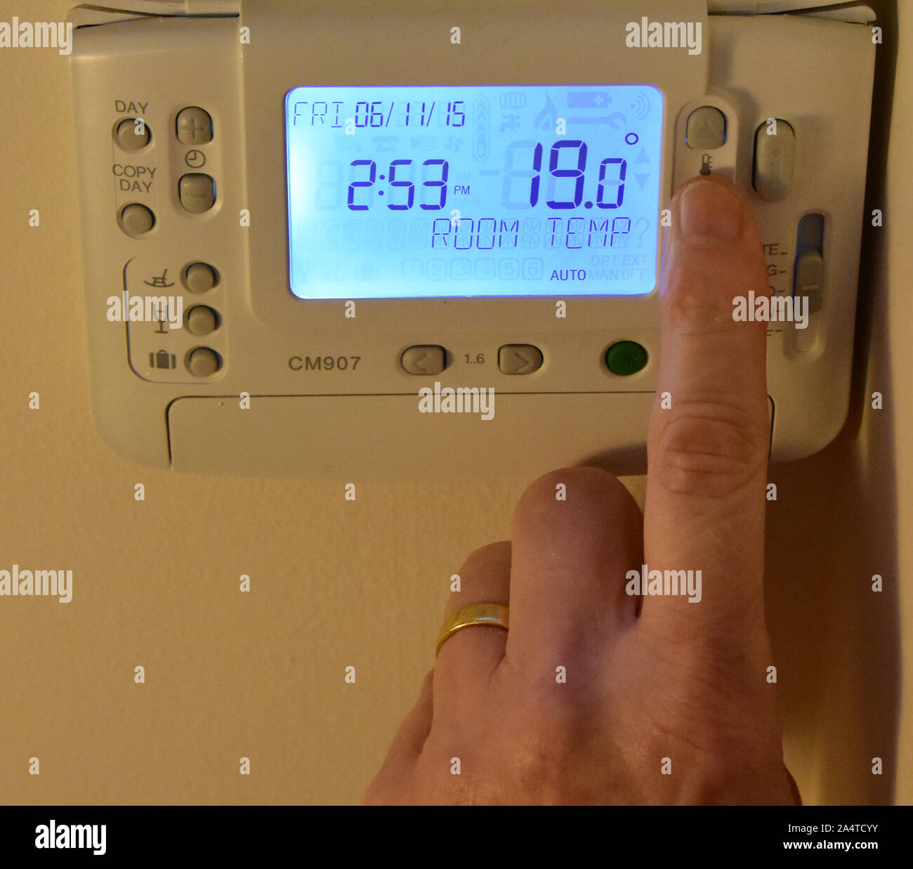 Changing the temperature on a thermostat Stock Photo Alamy
