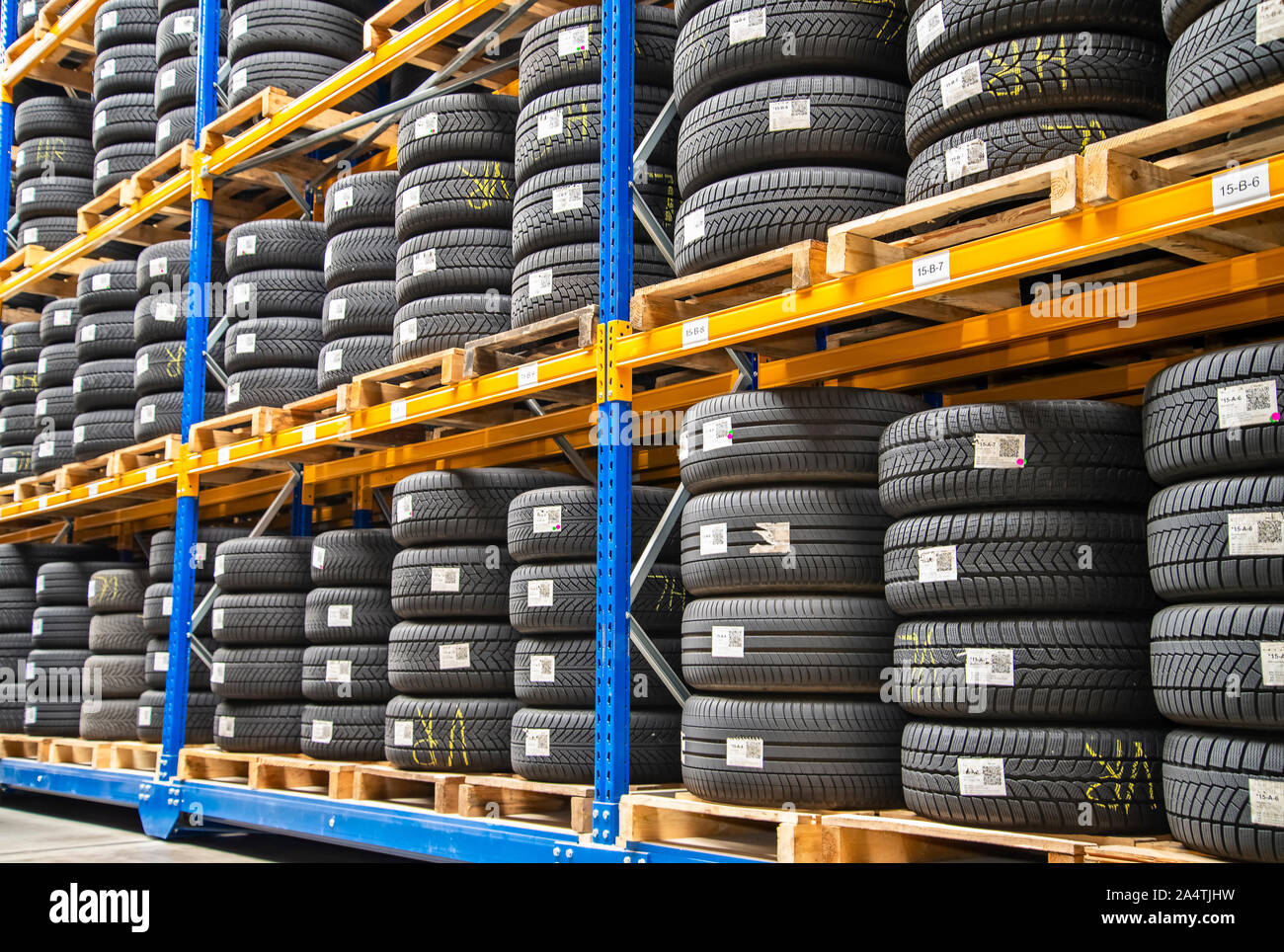 High rack with customer tires in a warehouse of a motor vehicle workshop Stock Photo