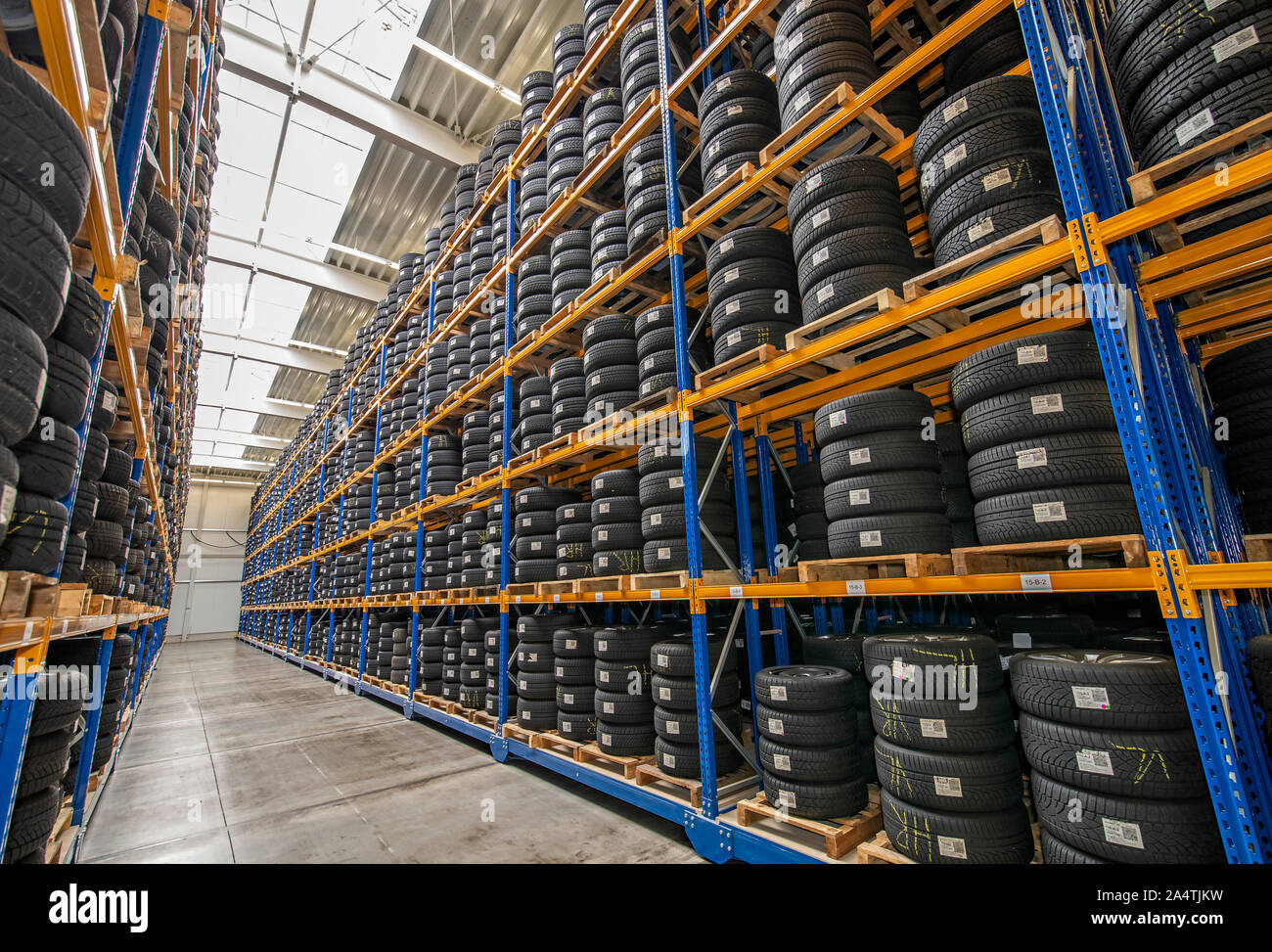 High rack with customer tires in warehouse of a tire dealer Stock Photo