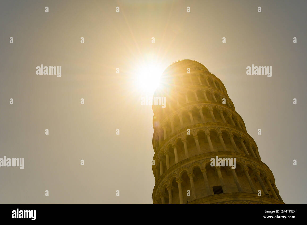 Backlit view of the Leaning Tower of Pisa, the freestanding bell tower of the Cathedral of Santa Maria Assunta in Piazza dei Miracoli, Tuscany, Italy Stock Photo