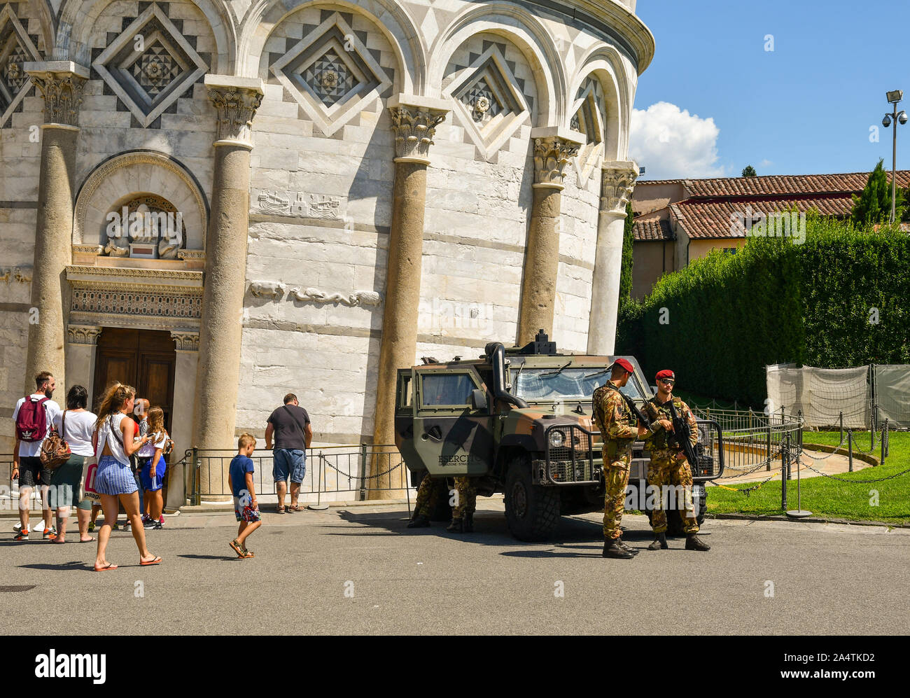 Soldiers of Italian army with a military vehicle Iveco LMV in front of the famous Leaning Tower of Pisa, Unesco World Heritage Site, Tuscany, Italy Stock Photo