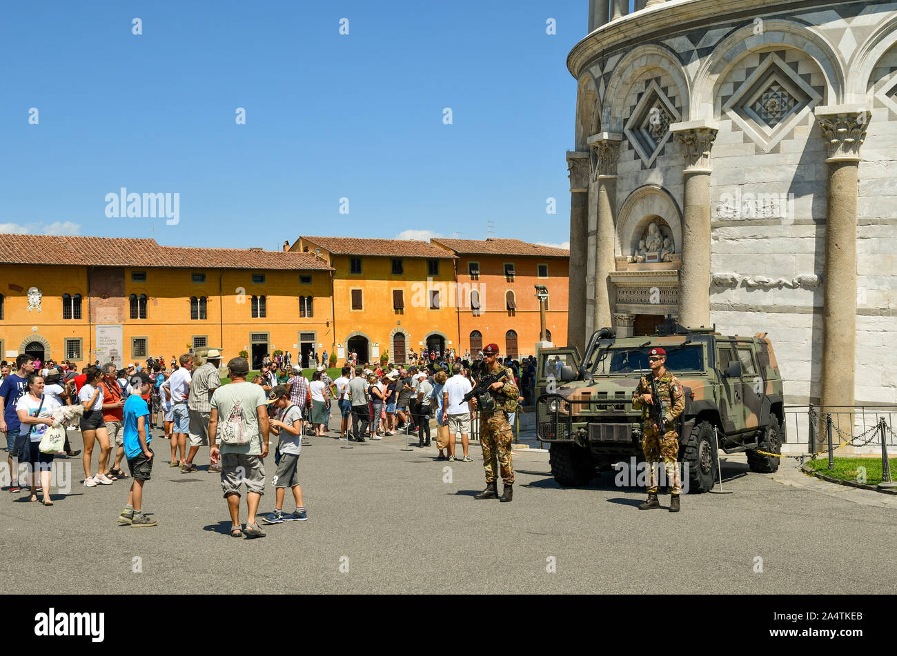 Soldiers of Italian army with a military vehicle Iveco LMV in front of the famous Leaning Tower of Pisa, Unesco World Heritage Site, Tuscany, Italy Stock Photo