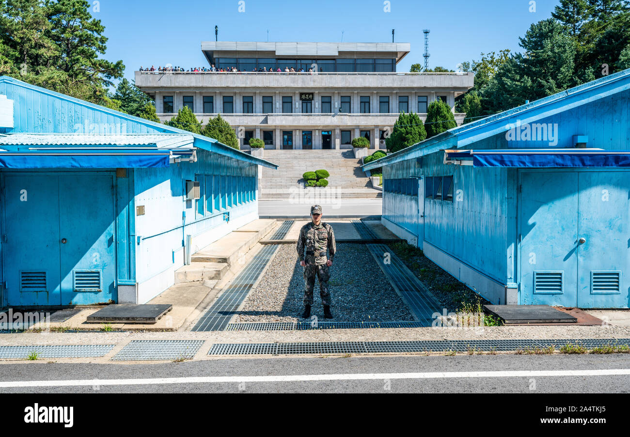 JSA Korea, 24 September 2019 : Border between the North and South Korea at the Joint Security Area or Panmunjom with blue huts and demarcation line in Stock Photo