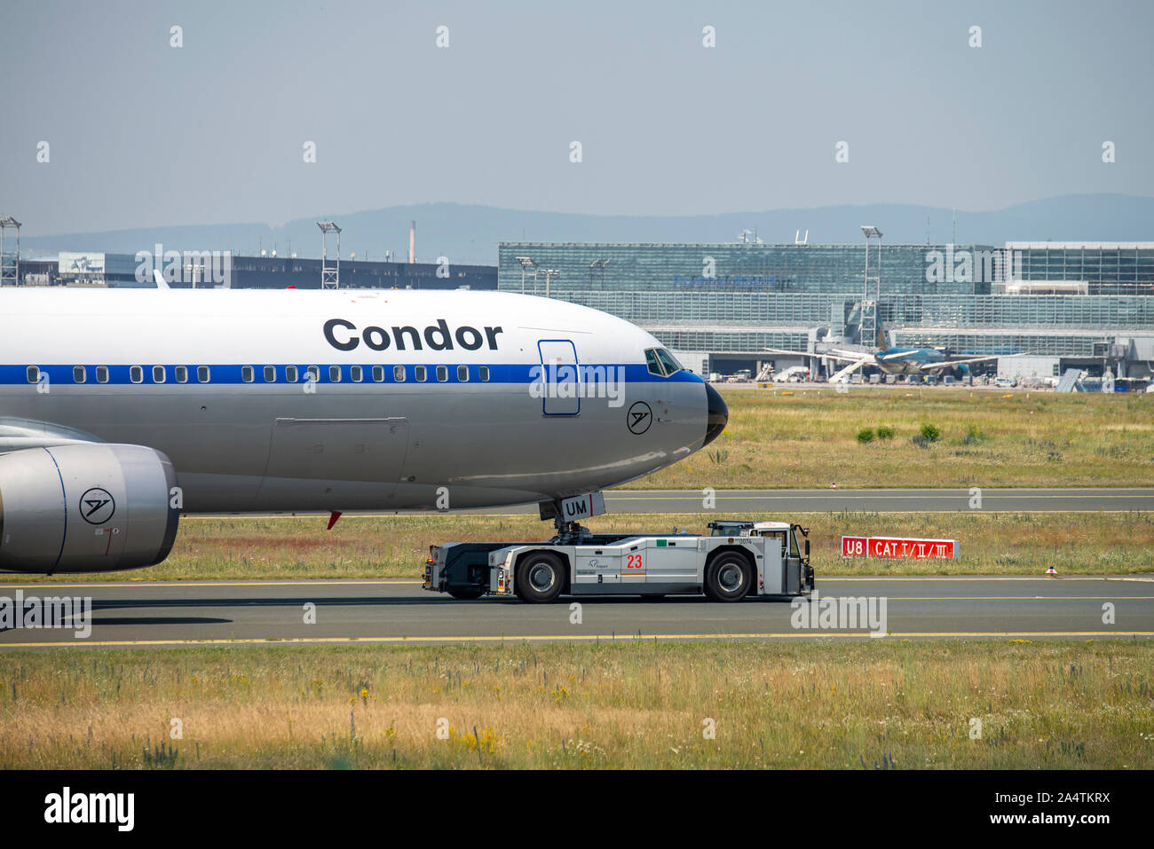 Frankfurt, Hesse/Germany - June 26 2019Condor aircraft with a special painting (Boeing 767-300 - D-ABUM) is towed by an aircraft tractor at Frankfurt Stock Photo