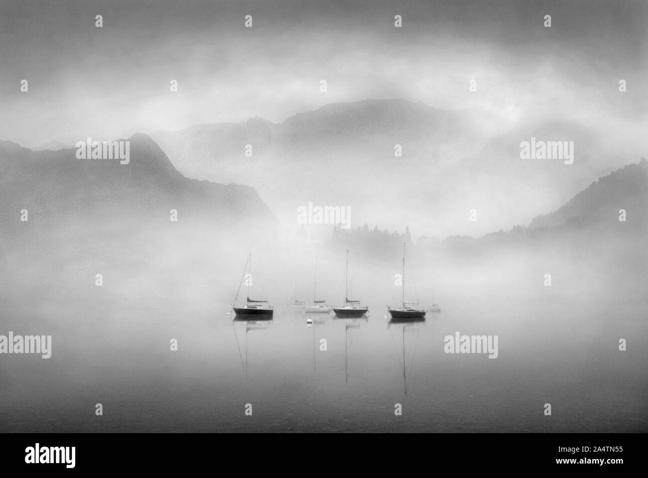 mist dawn over lake ullswater in monochrome Stock Photo