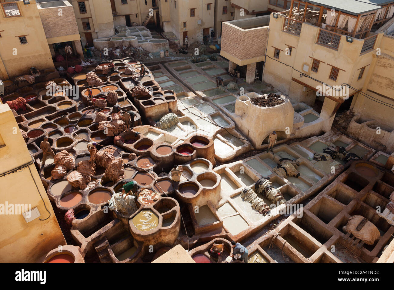 The tanneries are located in the medina of Fez, Morocco. It's a hard labour for the workers in a very smelly environement in Fes Stock Photo