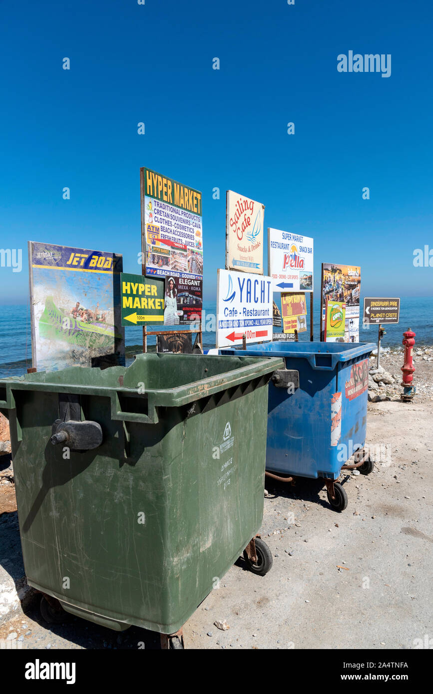 Gouves, Crete, Greece, October 2019.  Rubbish and recycling bins on the beach road in the seaside resort of Gouves, Crete. Stock Photo