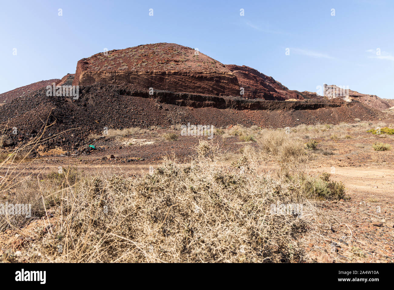 Rugged volcanic landscape and signs of quarry works in the Malpais de la Rasca near to Palm Mar, Tenerife, Canary Islands, Spain Stock Photo