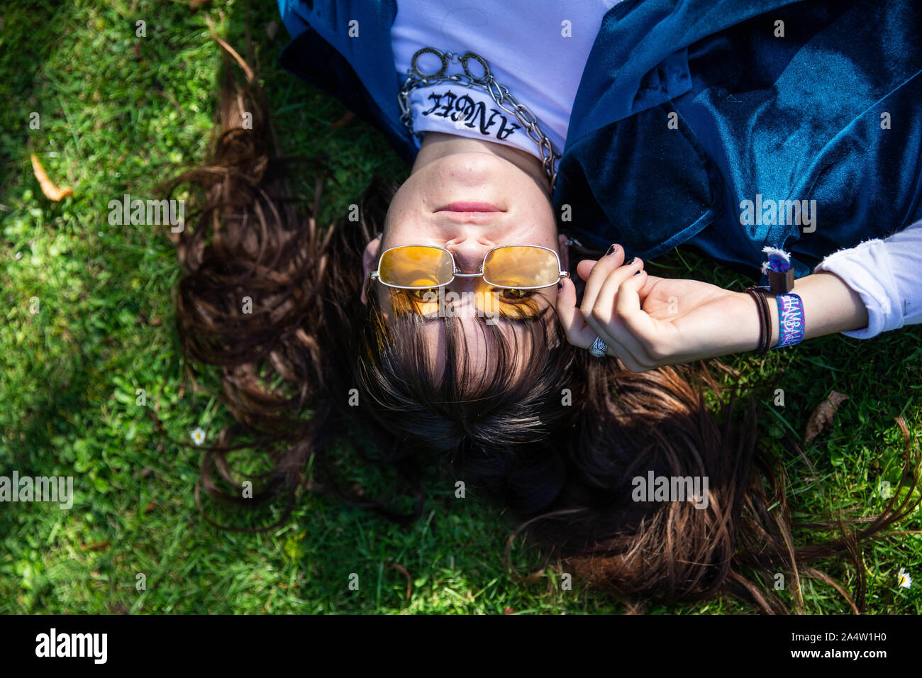 young model, lying in grass, fashion portrait Stock Photo