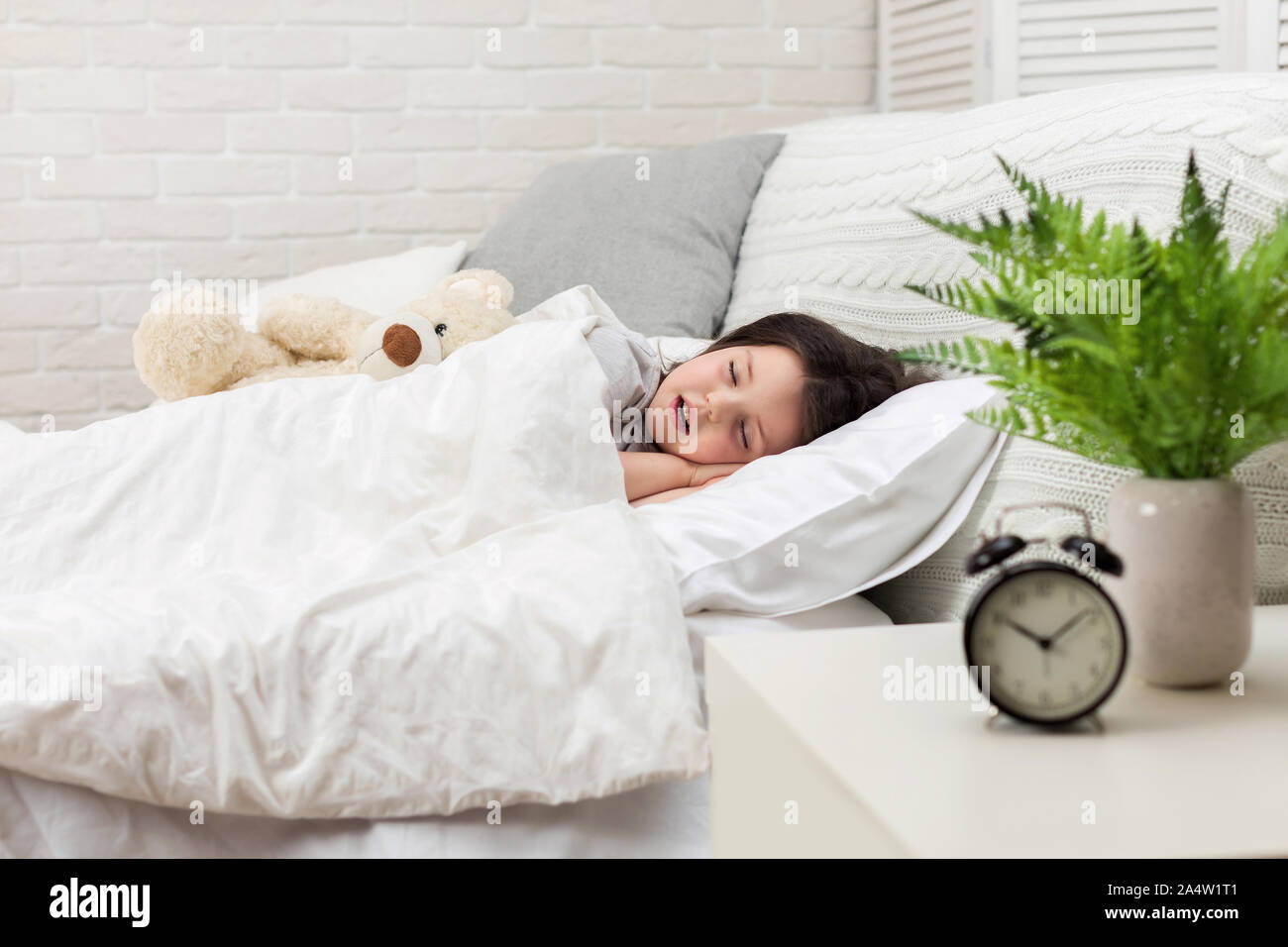Cute little child girl sleeping with teddy bear in her bed Stock Photo ...
