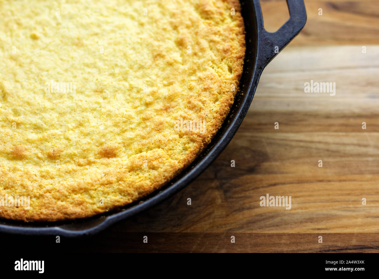 Traditional Southern cornbread baked in a cast iron skillet Stock Photo ...