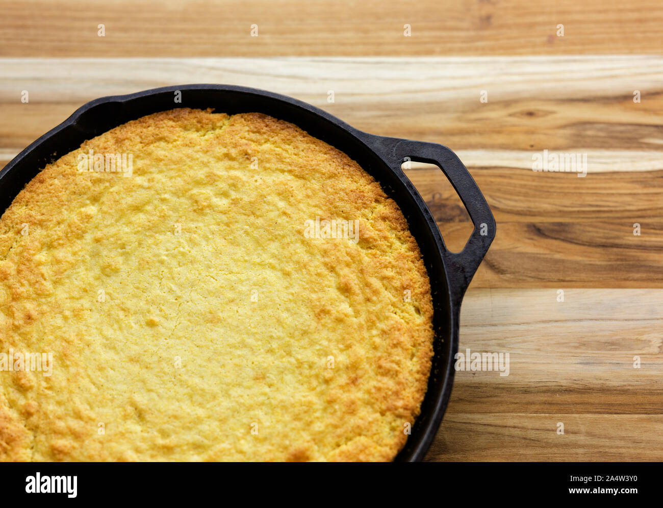 Traditional Southern cornbread baked in a cast iron skillet Stock Photo