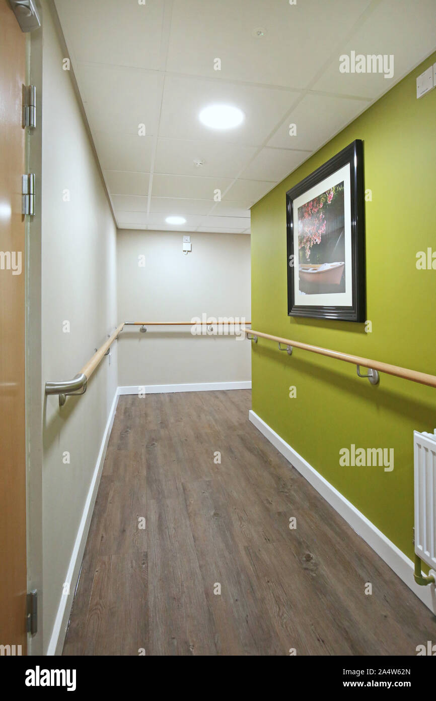 Access corridor in a newly refurbished care home near Wakefield, UK. Shows safety handrails and fire doors. Stock Photo