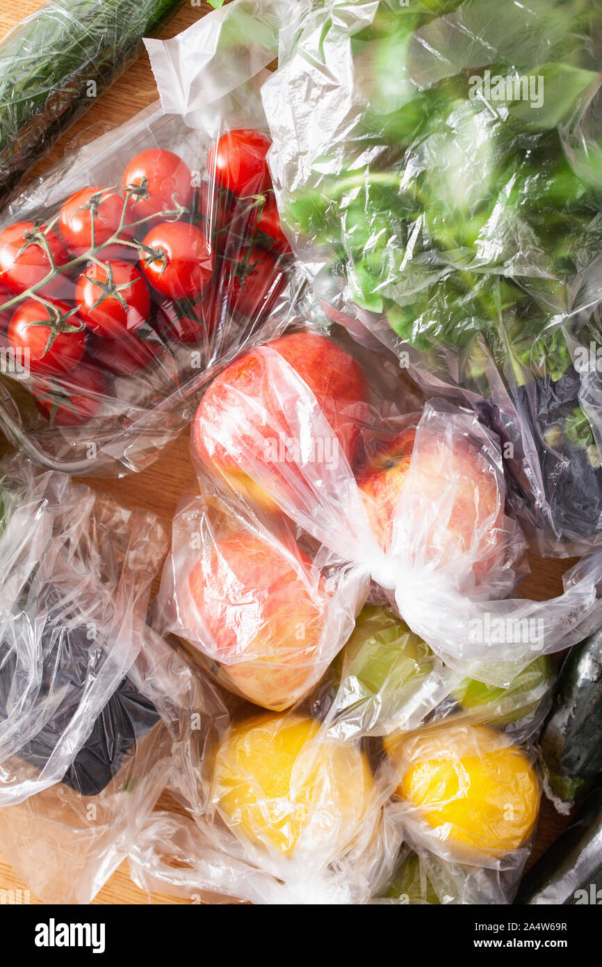 single use plastic waste issue. fruits and vegetables in plastic bags
