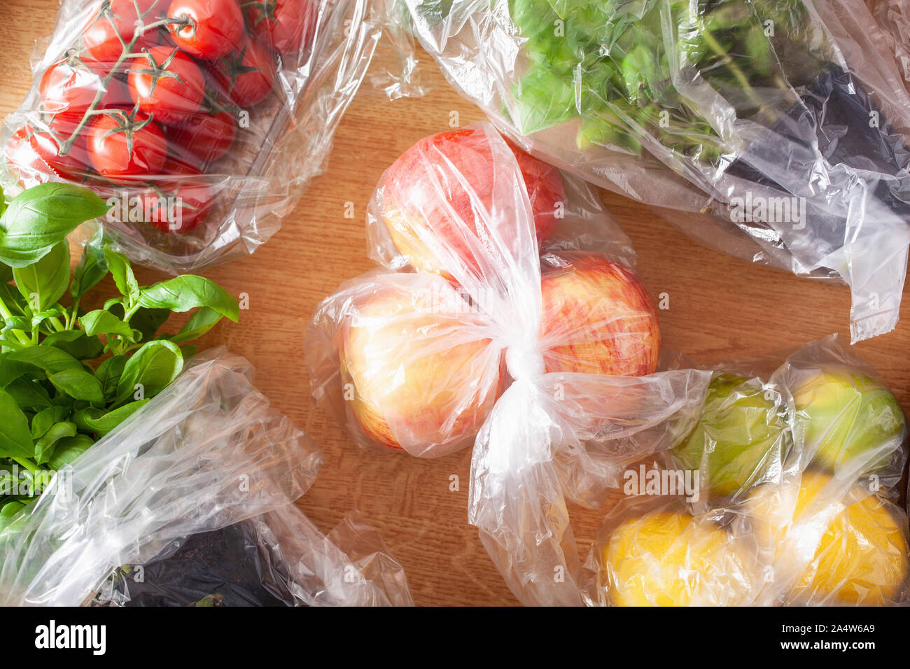 single use plastic waste issue. fruits and vegetables in plastic bags