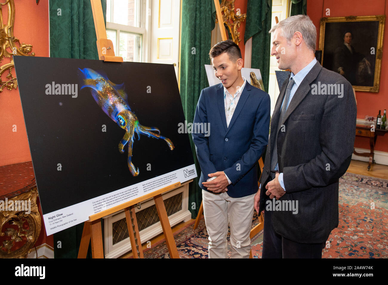 Minister at the Department for Environment, Food and Rural Affairs Zac Goldsmith meets winner of the Young Wildlife Photographer of the Year competition Cruz Erdmann (left) at a reception previewing images from the Natural History Museum's 55th Wildlife Photographer of the Year competition at Downing Street, London. PA Photo. Picture date: Wednesday October 16, 2019. See PA story ENVIRONMENT Photography. Photo credit should read: Dominic Lipinski/PA Wire Stock Photo