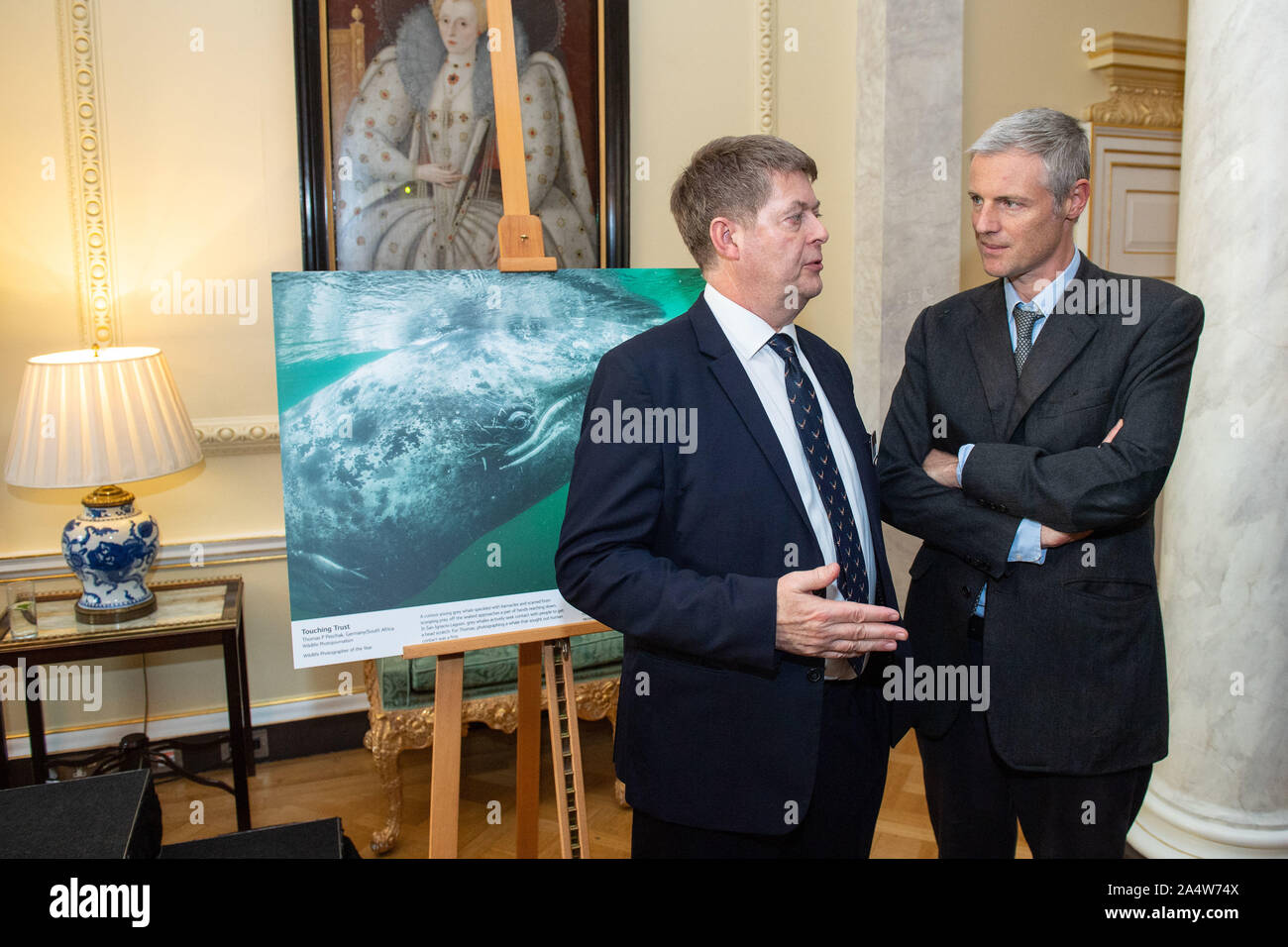 Natural History Museum Director Sir Michael Dixon (left) and Minister at the Department for Environment, Food and Rural Affairs Zac Goldsmith (right) speaks at a reception previewing images from the Natural History Museum's 55th Wildlife Photographer of the Year competition at Downing Street, London. PA Photo. Picture date: Wednesday October 16, 2019. See PA story ENVIRONMENT Photography. Photo credit should read: Dominic Lipinski/PA Wire Stock Photo
