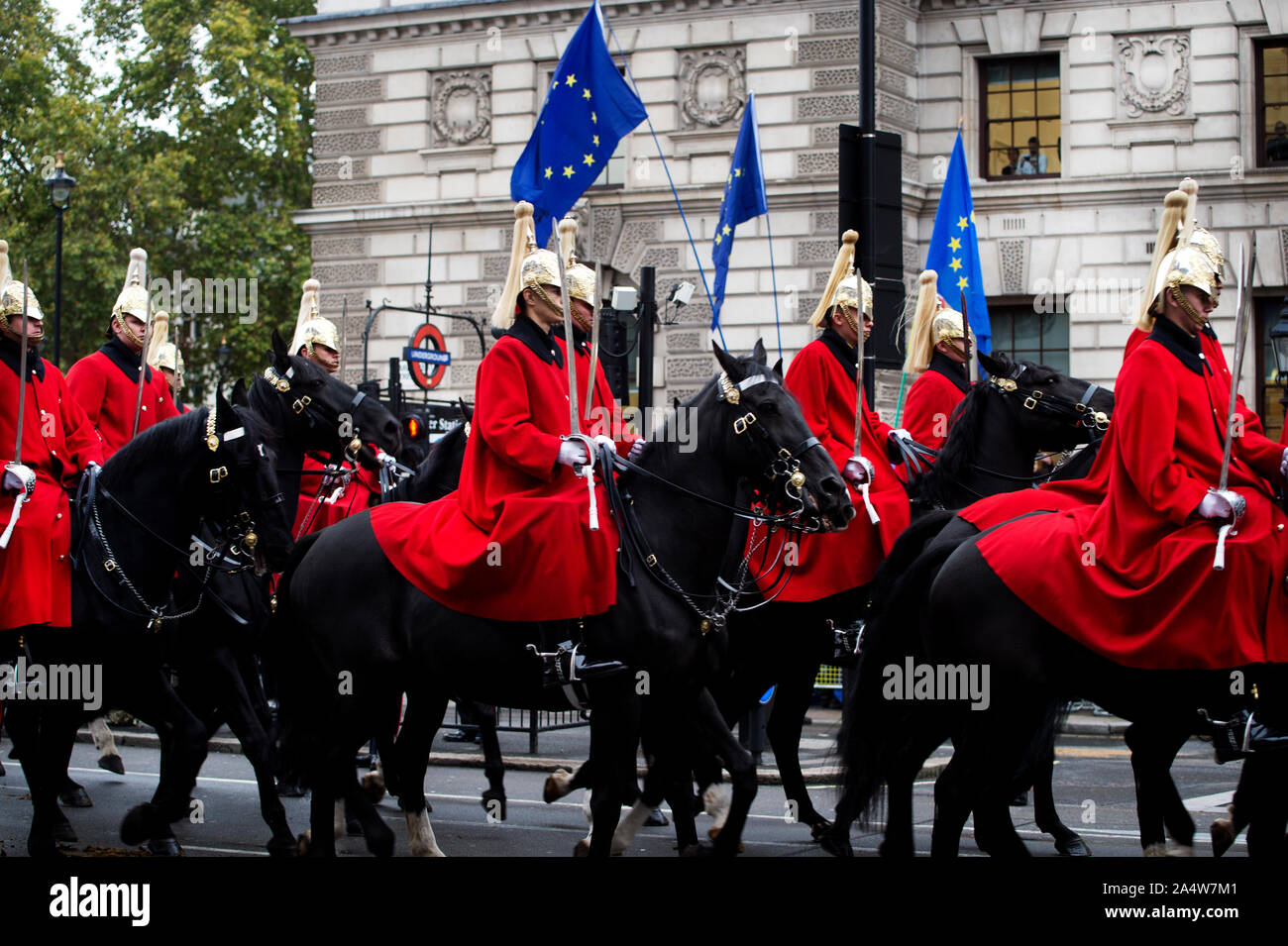 London, Westminster October 14th 2019 State Opening of Parliament. Mounted Horseguards ride in front of European flags. Stock Photo