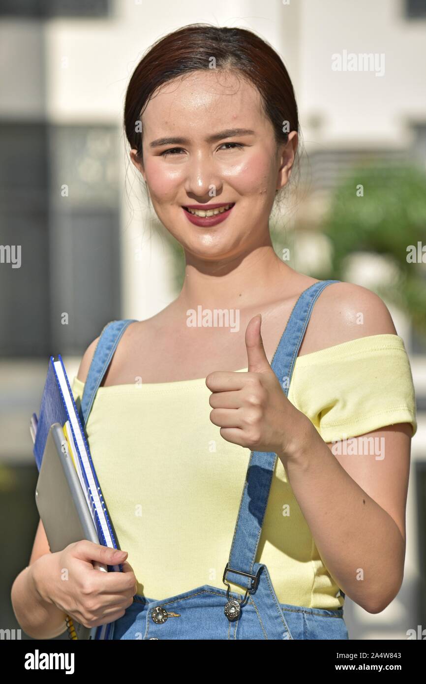 Student Teenager School Girl With Thumbs Up Stock Photo - Alamy