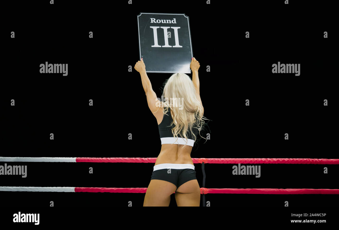 ring girl hold hands display in number of round competition in MMA Stock Photo