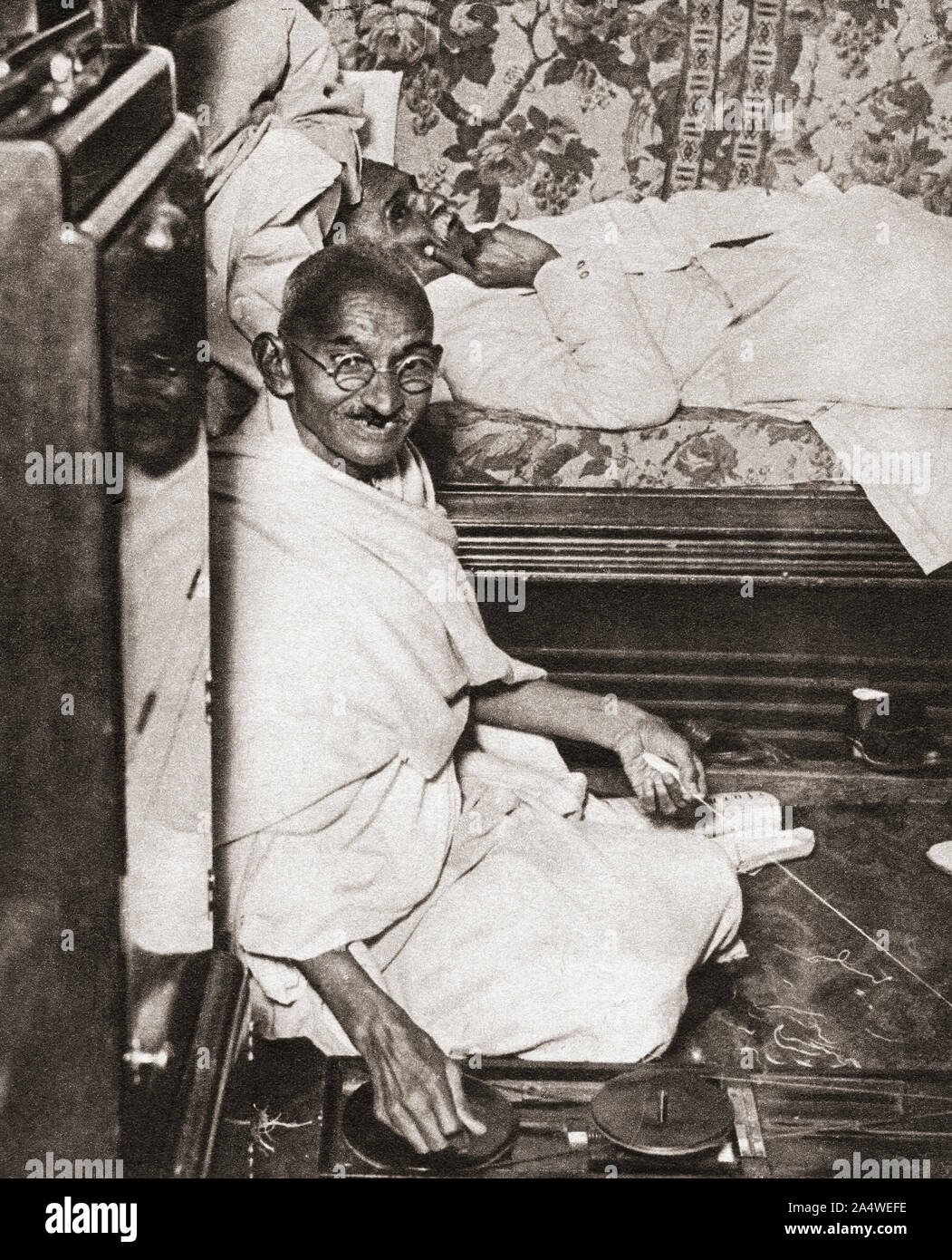 Mohandas Karamchand Gandhi, aka Mahatma Gandhi, 1869 – 1948. Indian activist, leader of the Indian independence movement against British rule. Seen here at the Round Table Conference, 1931. From The Pageant of the Century, published 1934. Stock Photo