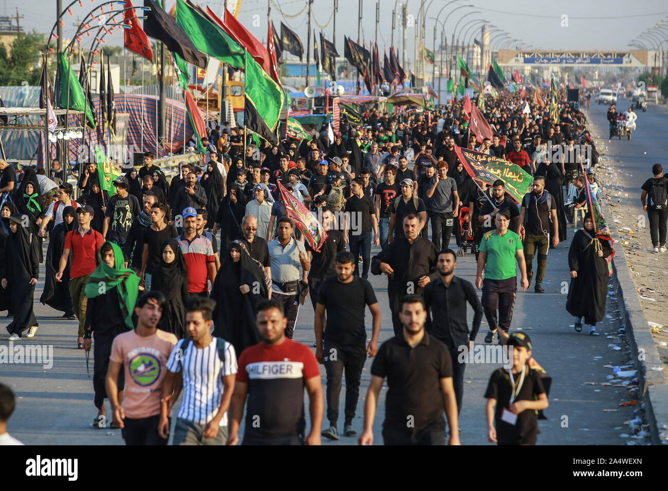 Baghdad, Iraq. 16th Oct, 2019. Shia Muslims march from Baghdad to visit the the Husayn Mosque in Karbala on the occasion of Arba'een, also known as Chehelom, a religious observance that occurs forty days after the Day of Ashura to commemorate the martyrdom of Husayn ibn Ali, the grandson of the Islamic Prophet Muhammad, who was killed on the 10th day of the month of Muharram, according to Islamic calendar. Credit: Ameer Al Mohammedaw/dpa/Alamy Live News Stock Photo