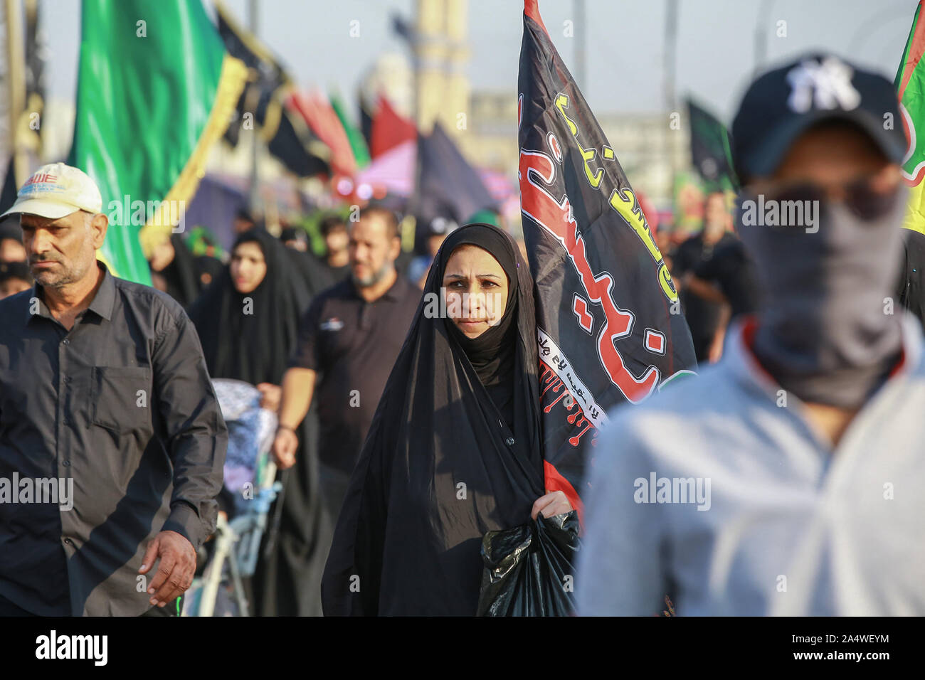 Baghdad, Iraq. 16th Oct, 2019. Shia Muslims march from Baghdad to visit the the Husayn Mosque in Karbala on the occasion of Arba'een, also known as Chehelom, a religious observance that occurs forty days after the Day of Ashura to commemorate the martyrdom of Husayn ibn Ali, the grandson of the Islamic Prophet Muhammad, who was killed on the 10th day of the month of Muharram, according to Islamic calendar. Credit: Ameer Al Mohammedaw/dpa/Alamy Live News Stock Photo