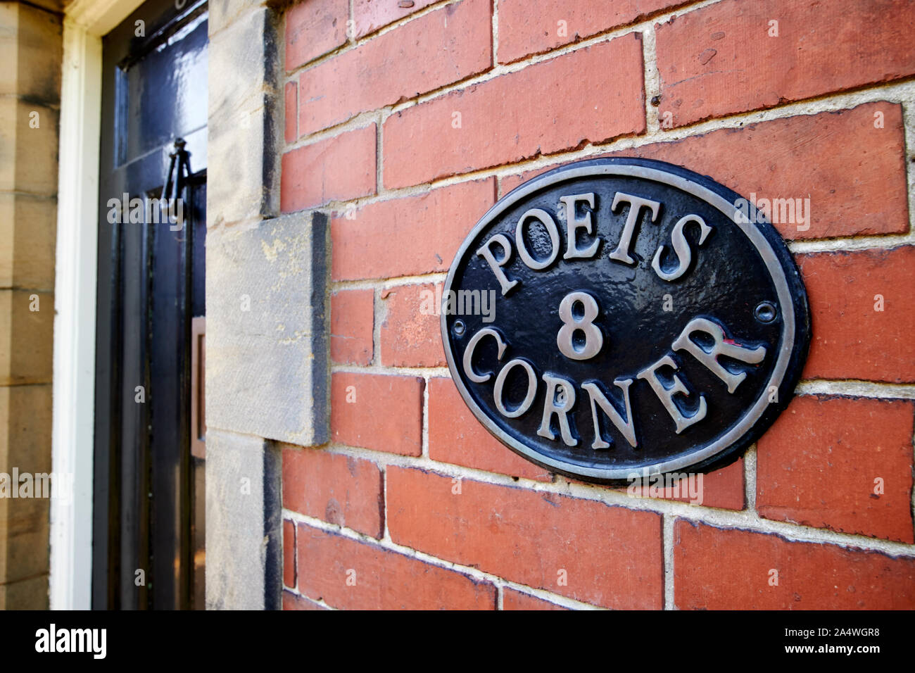 sign on a house 8 poets corner Port Sunlight England UK Stock Photo