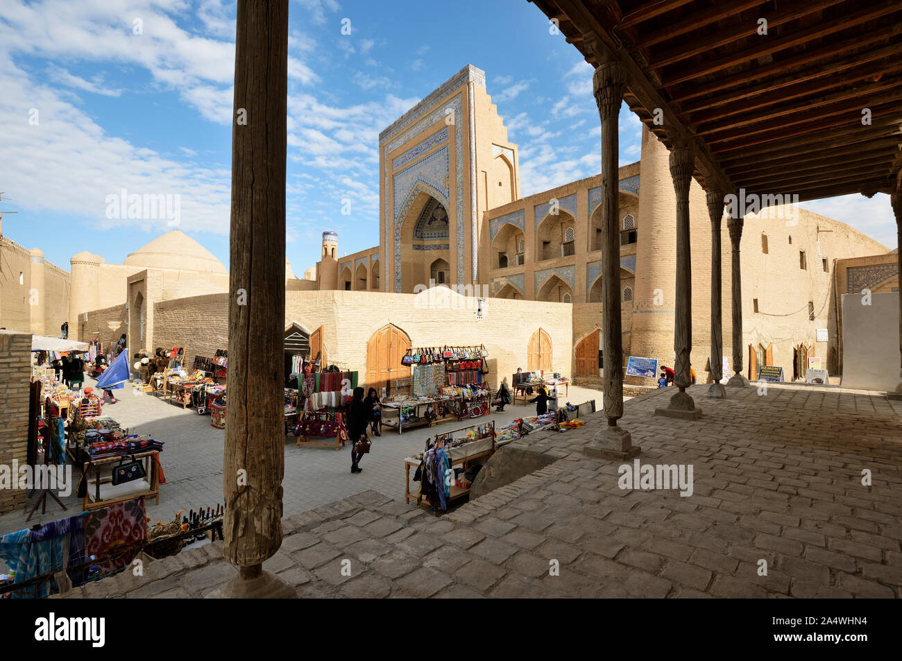 Kutlug Murad Inak Madrassah and the main shopping street. Khiva, a UNESCO World Heritage Site, Uzbekistan Stock Photo