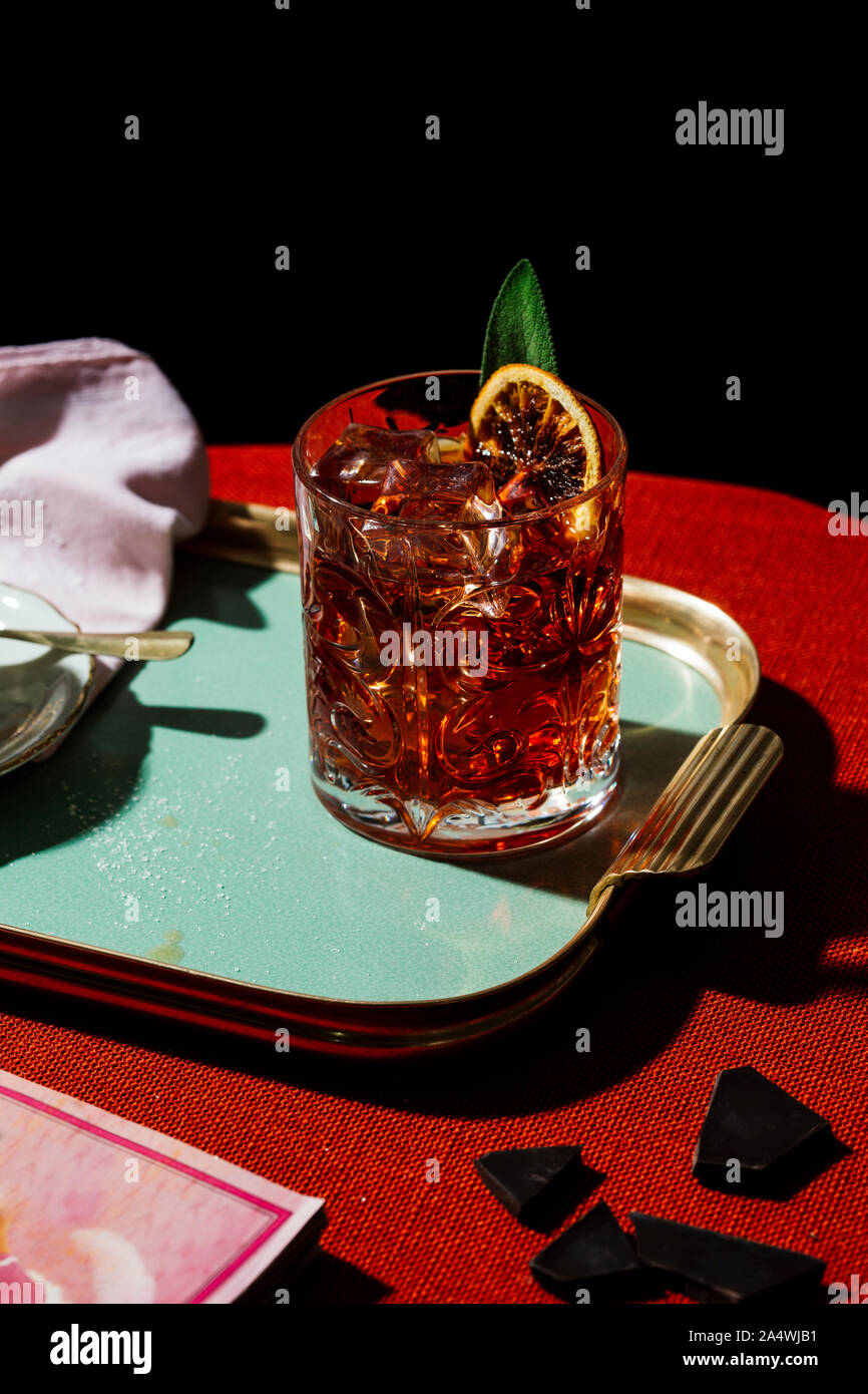 Negroni, a popular italian alcoholic aperitif cocktail, with a light
