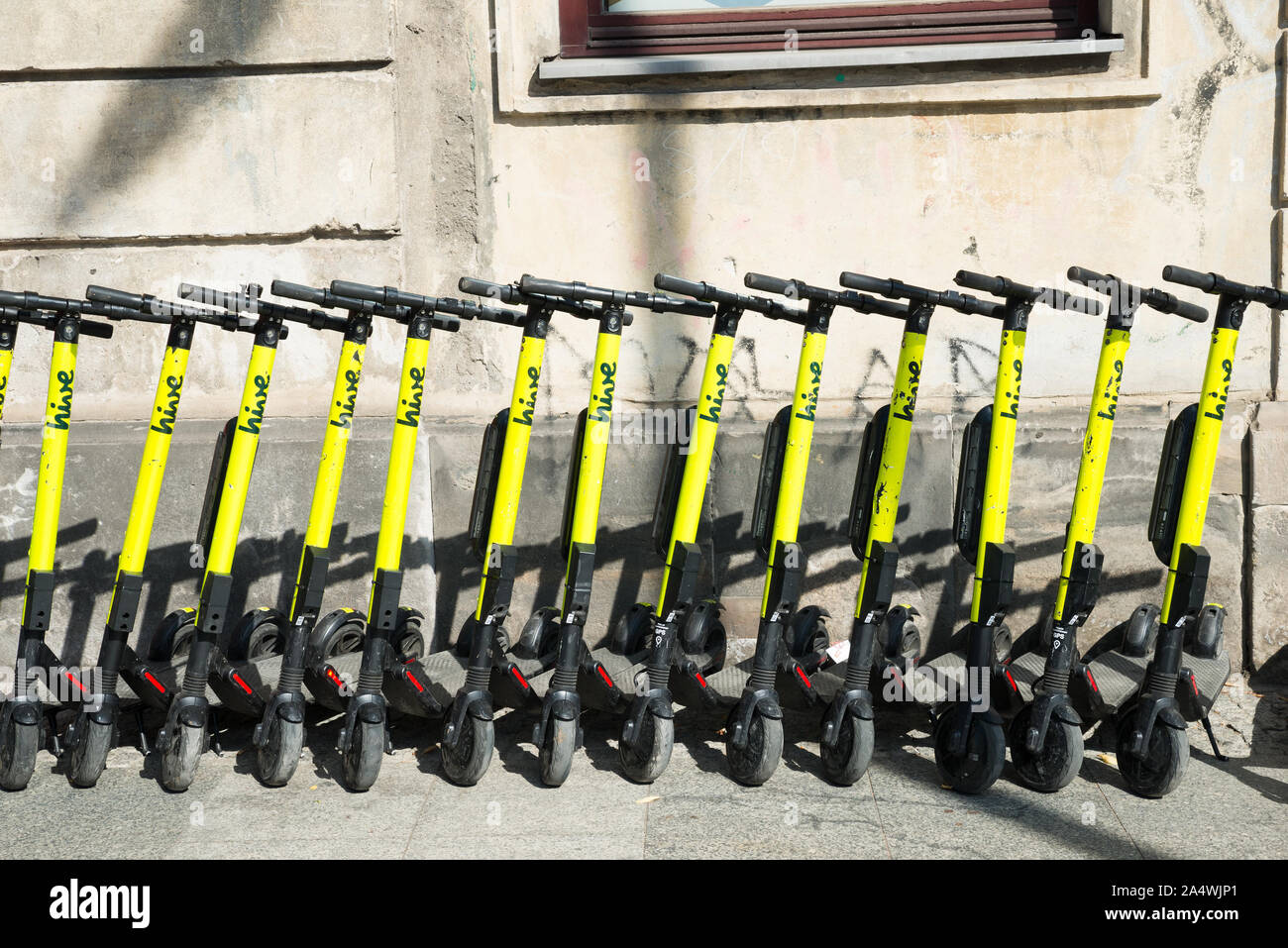 electric kick scooters from scooter-sharing system parked on a sidewalk in Warsaw, Poland Stock Photo