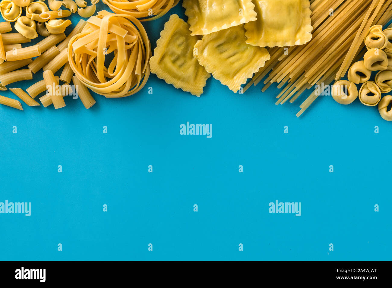 Different types of pasta. Ravioli, penne pasta, tortellini and